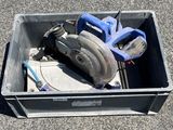 a box with tools in it sitting on the ground