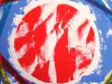 a close up of a picture of a red and blue circle