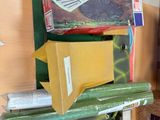 boxes stacked on top of each other on a shelf in a room