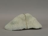 a small piece of white material on a table