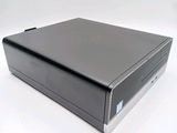 an image of a small black computer on a white surface