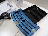 an image of a cell phone and charger on a desk