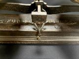 an old metal machine that is sitting on a table