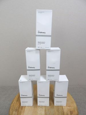 five boxes stacked on top of each other on a wooden stand