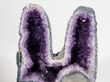 an image of a piece of amethorate sitting on top of a white surface