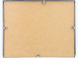 a close up of a piece of cardboard with a metal frame