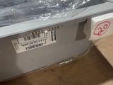 a box that is wrapped in plastic and sitting on the floor