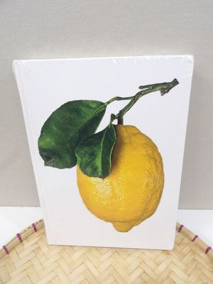 a picture of a lemon with a green leaf on it