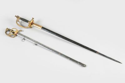 two swords, one with a gold handle and one with a black handle