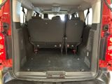 two seats in the back of a van with the doors open