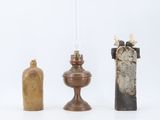 three different types of candles on a white background