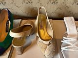 several pairs of women ' s shoes are lined up on a shelf