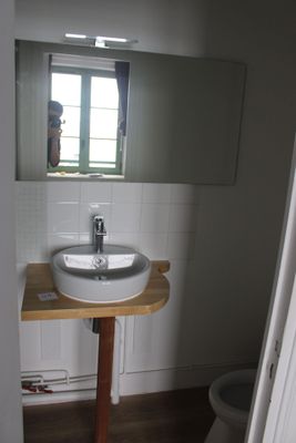a bathroom with a sink and a toilet in it