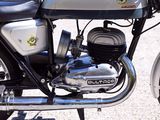a close up of a motorcycle parked on the street