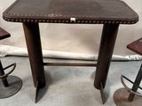 three stools and a table in a room