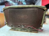 an old radio sitting on top of a table