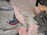 a pile of toilet paper and other items on the floor