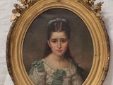 portrait d'une jeune fille en robe verte, dans un cadre doré