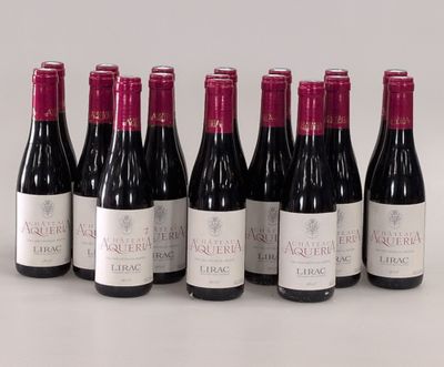 six bottles of wine are lined up in a row on a table