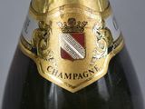 a close up of a bottle of champagne on a table