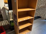 a shelf that has a bunch of boxes on top of it