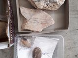 a box that has some rocks and a rock in it