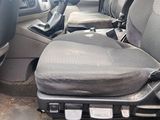 a seat in the back of a car with a seat cushion on it