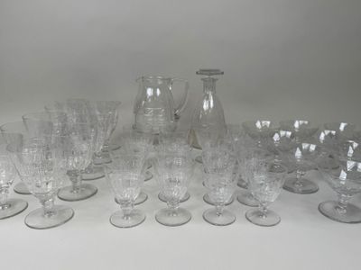 a lot of glasses and a pitcher on the table