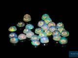 a lot of small white oplites on a black surface