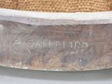 a close up of a piece of wood with writing on it