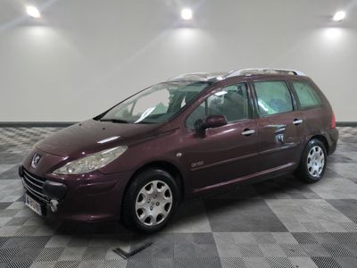 a picture of a maroon minivan parked in a garage