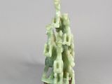 chinese carved jade figurine of a man and a woman on a pedestal