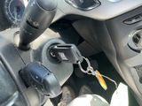 a close up of a car ' s dashboard with a key in it