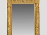 an image of a gold mirror with a sunburst above it