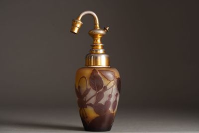 an image of a brown and gold vase with a faucet