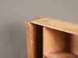 a wooden shelf with two open shelves on it