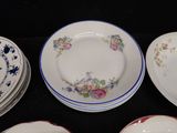 many plates that are sitting on a black table