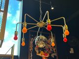a chandelier with a mirror ball hanging from the ceiling