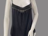 an image of a mannequin wearing a black top and leggings
