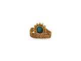 a close up of a gold ring with a turquoise stone