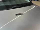 a car that has a sticker on the hood of it