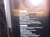 a close up of a person ' s hand holding a microwave