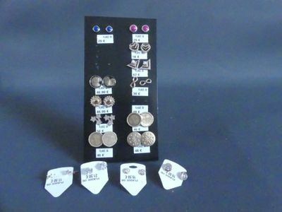 a display case with several different types of earrings
