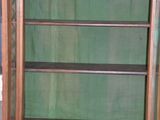 a wooden display case with glass shelves in it