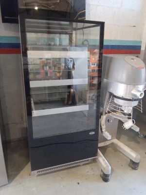 an image of a refrigerator and a mixer in a room