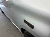 a close up of a car with a sticker on it