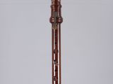 an image of a tall wooden pipe on a white surface