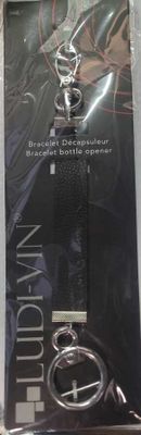 packaging of a black and silver keychain on a white background