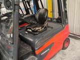 a forklift truck that is parked in a warehouse
