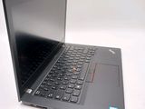 a laptop that is open on a white surface